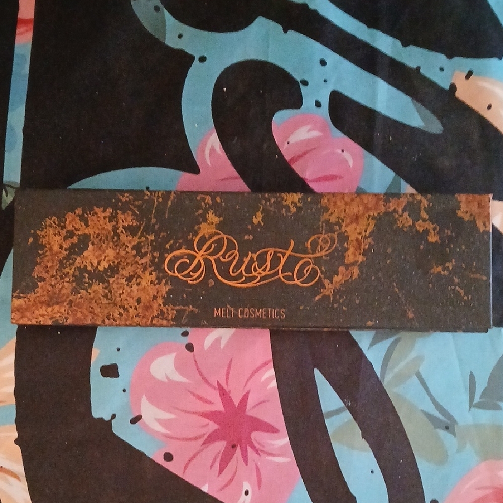 Melt Cosmetics Rust Eyeshadow Palette in Black and Gold Accents